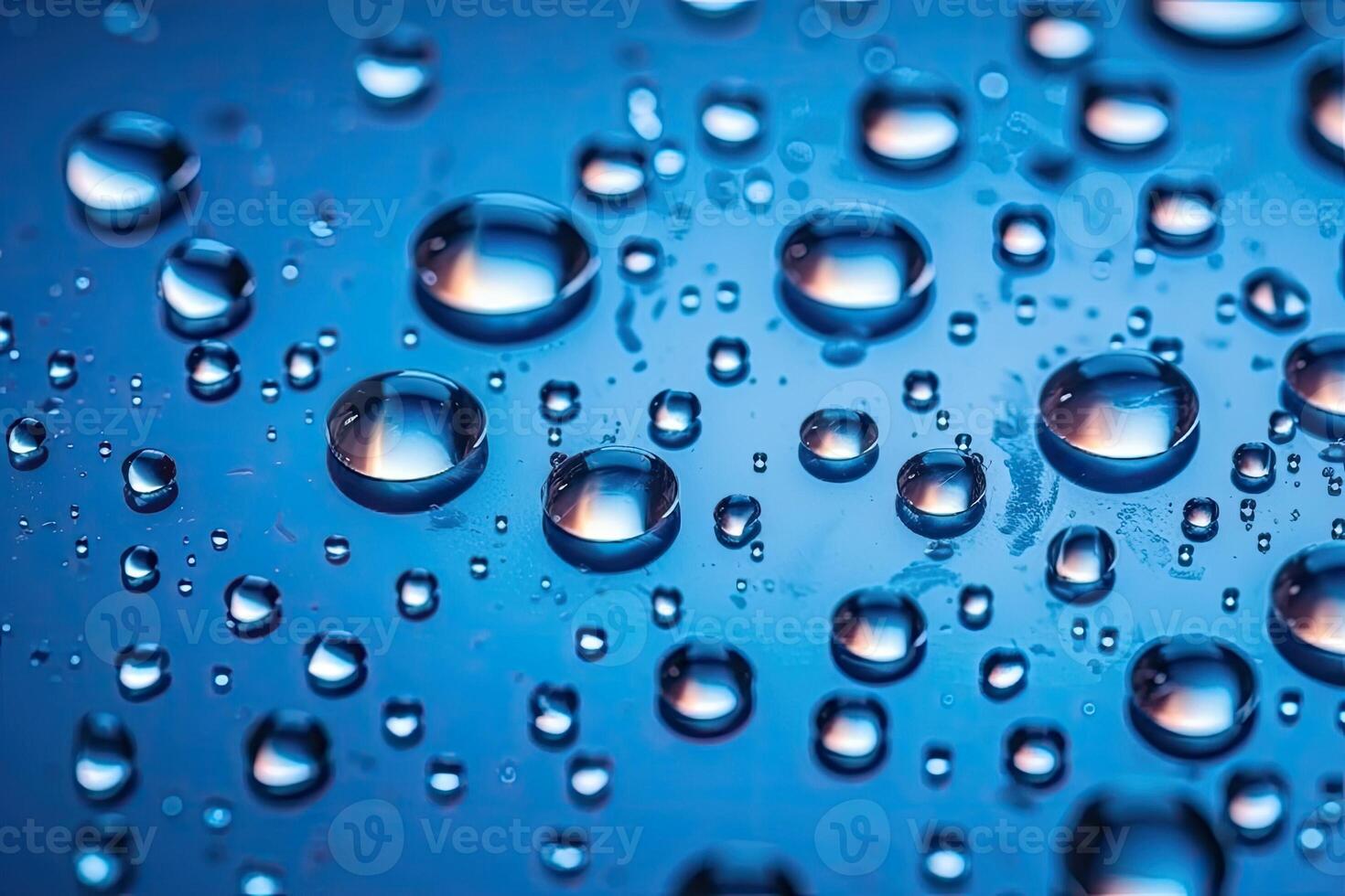 water droplets on a blue surface photo