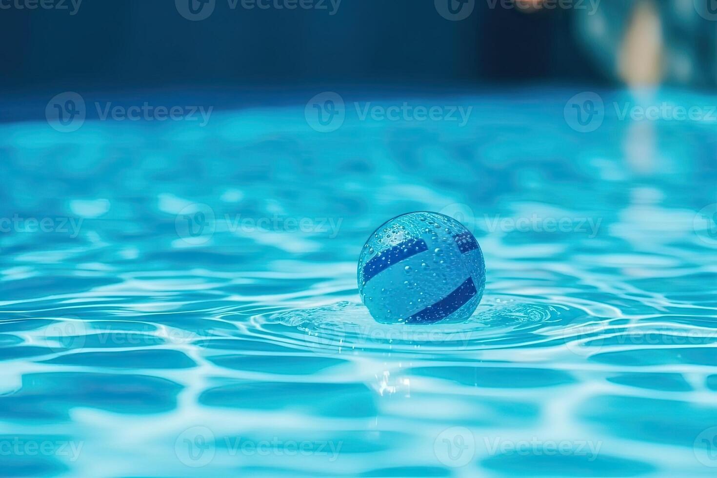 A blue ball floating in a pool photo