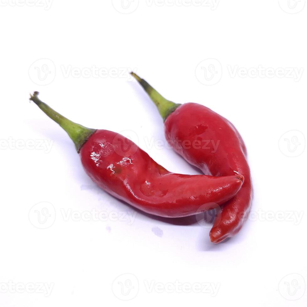 A photo of two red chilies with a vibrant color and glossy texture, giving a spicy and intense appearance.