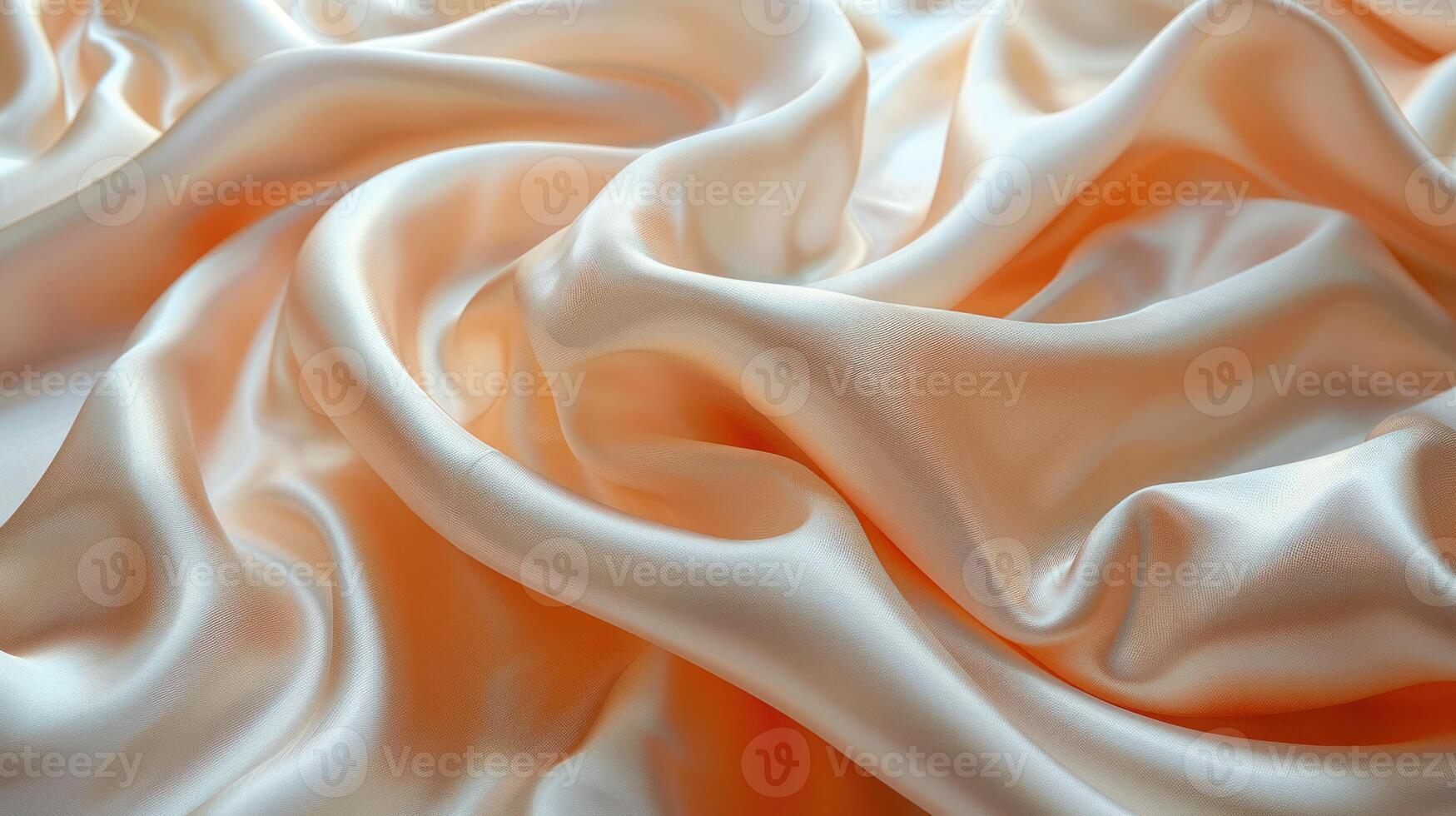 Soft, flowing peach-toned satin fabric draped in elegant folds. photo