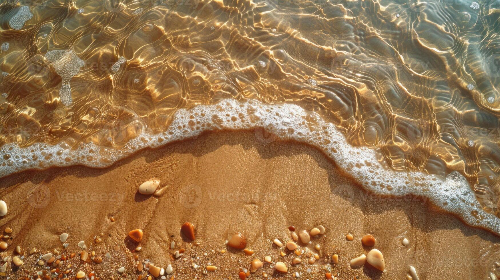 Gentle waves lapping at a light beige sandy beach, with small pebbles and shells scattered along the shore. Clear, shallow water. photo