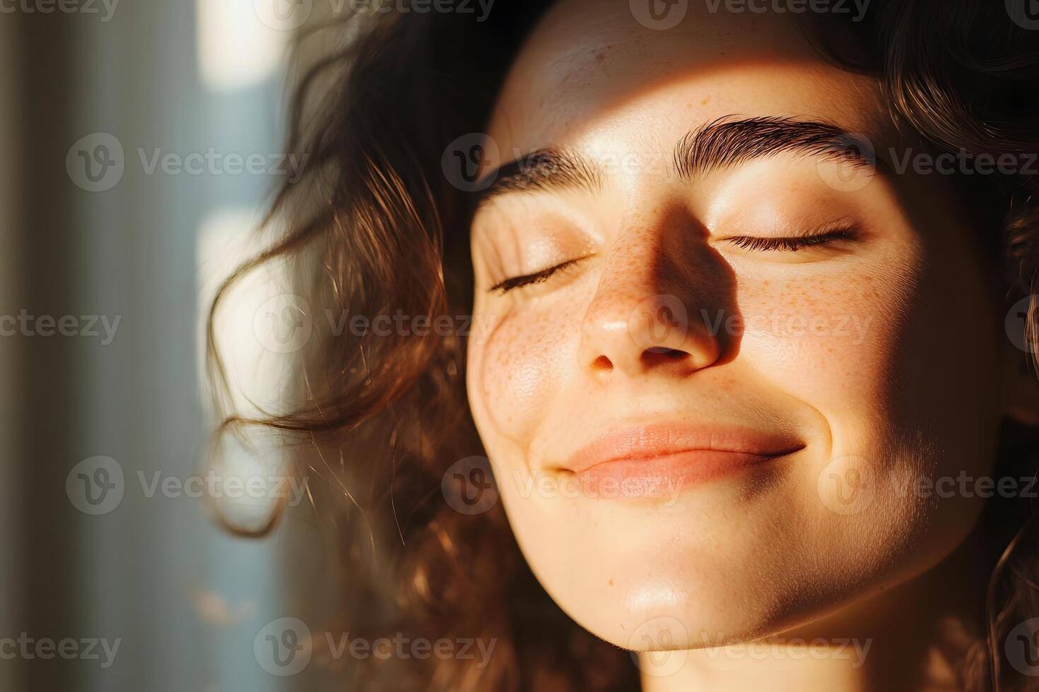 Joyful Person Basking in Warm Sunlight with Eyes Closed and Serene Smile Representing Natural photo