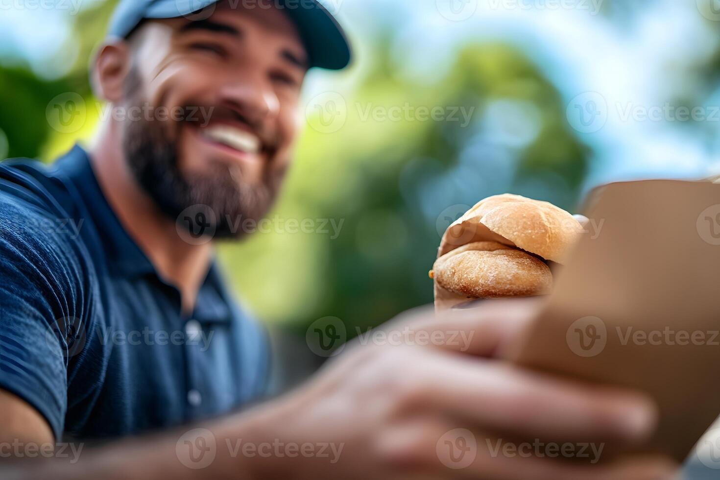 Friendly Delivery Driver Handing Food Package to Smiling Customer at Front Door photo