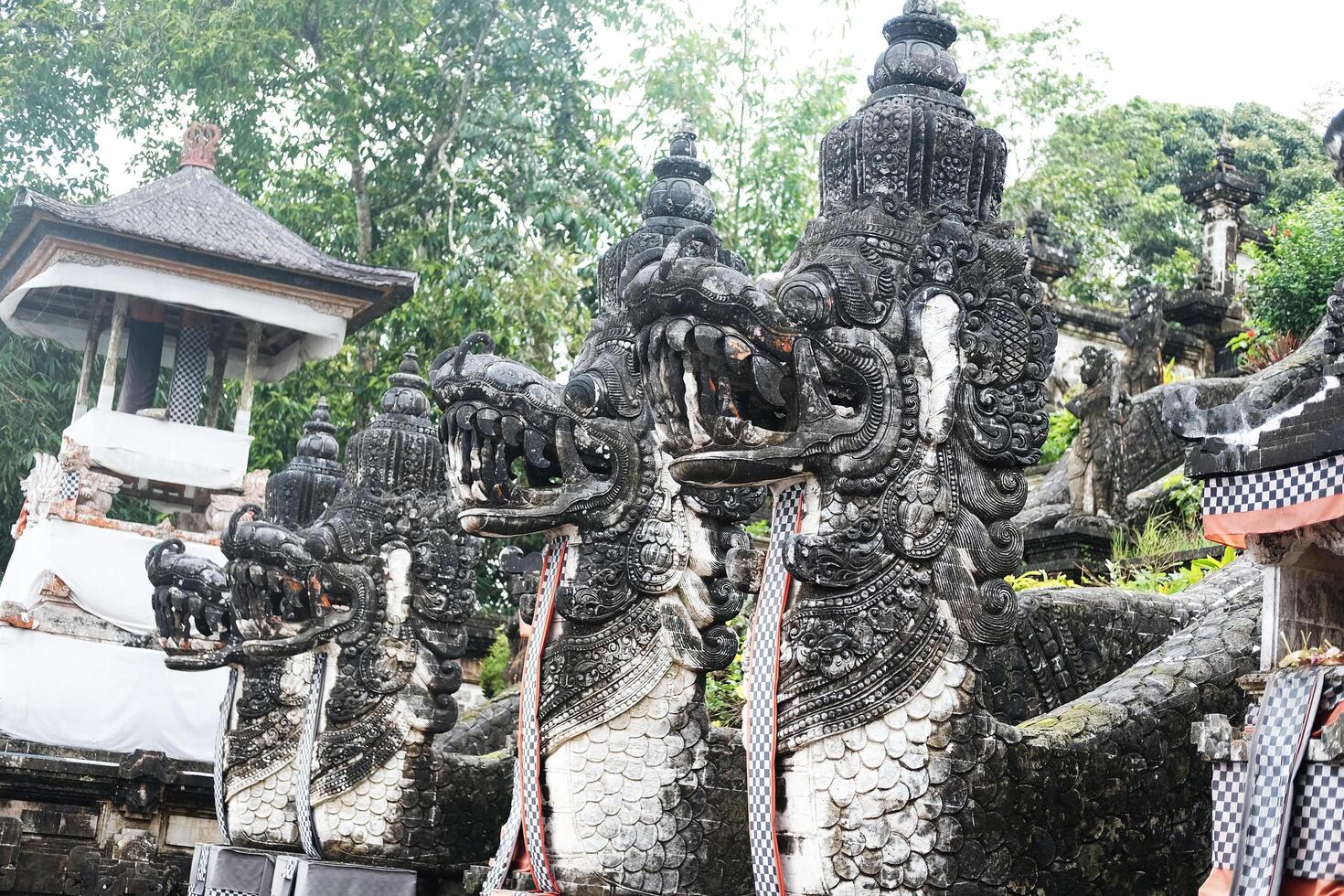 Ancient three lions stucco statue is god and belief in Hindu with religion and culture decorated outdoor front stone stair of Pura Luhur Lempuyang Temple in Bali, Indonesia photo
