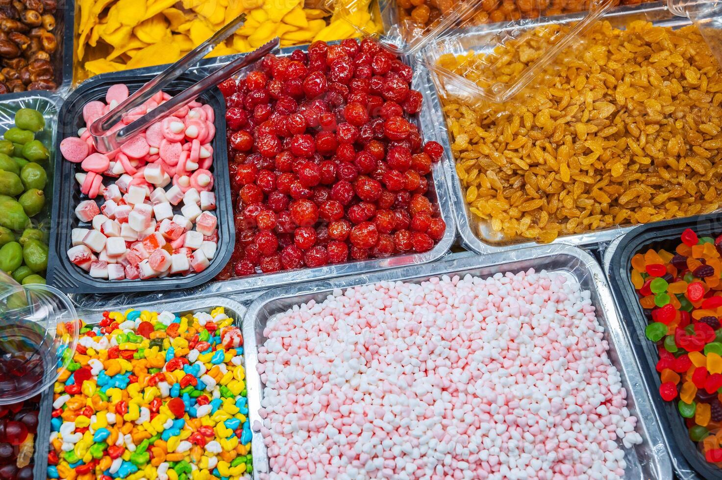 Colorful background of candies, jellies, marmalade and dried fruits photo