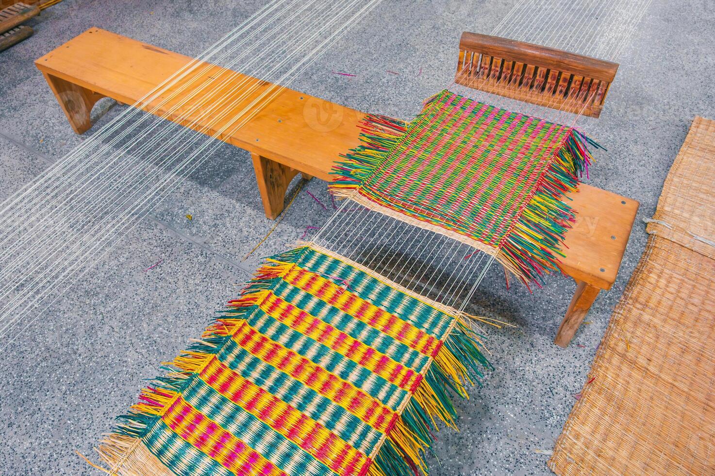 weaving and making a handmade rug. close-up of a loom. photo