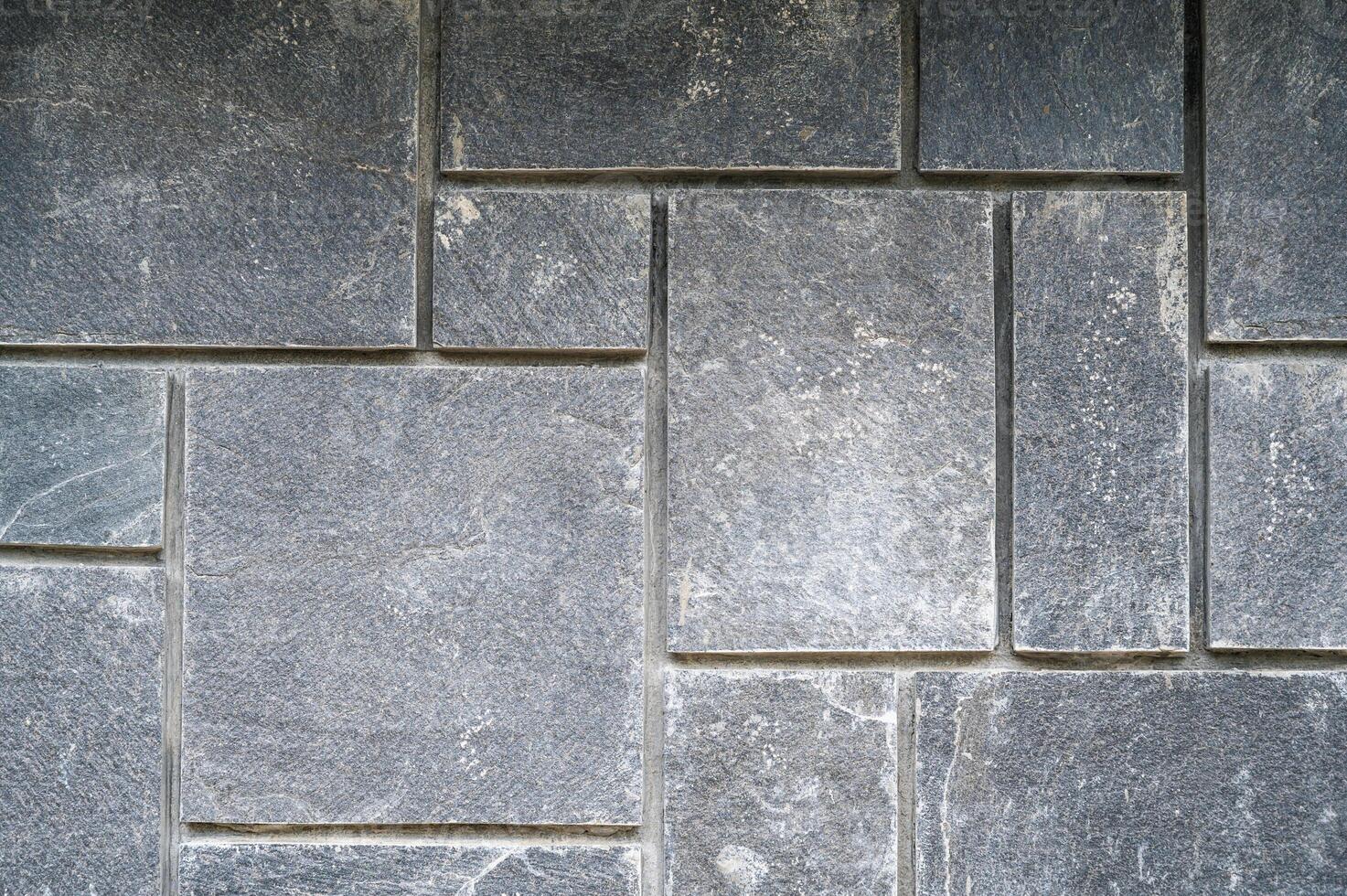 A pattern of grey paving street tiles. photo