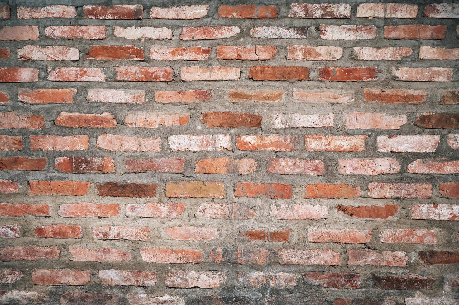 Red brick background. The texture of the red brick stone wall. photo