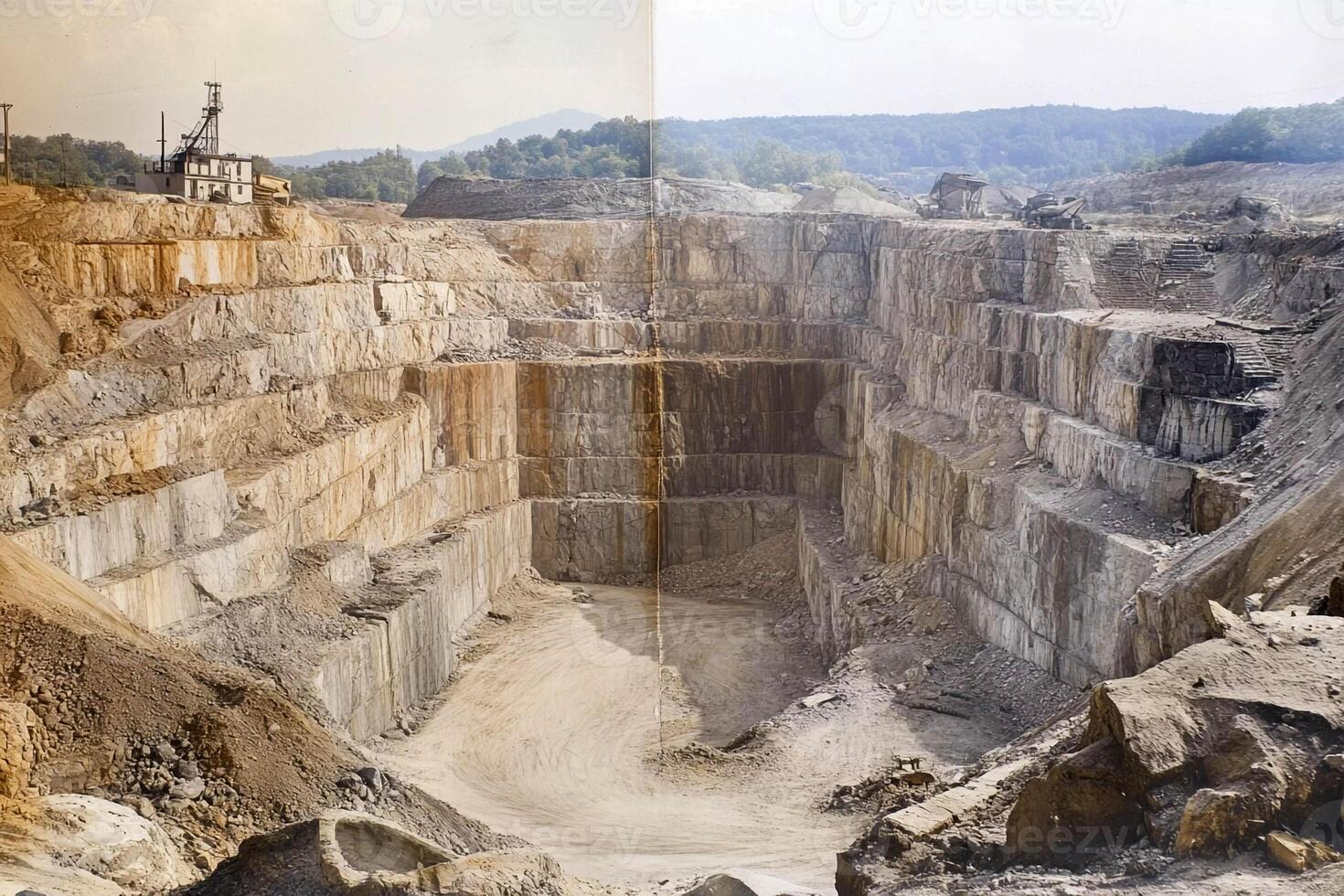 Quarry in operation showing layers of rock and machinery at work during daylight hours photo