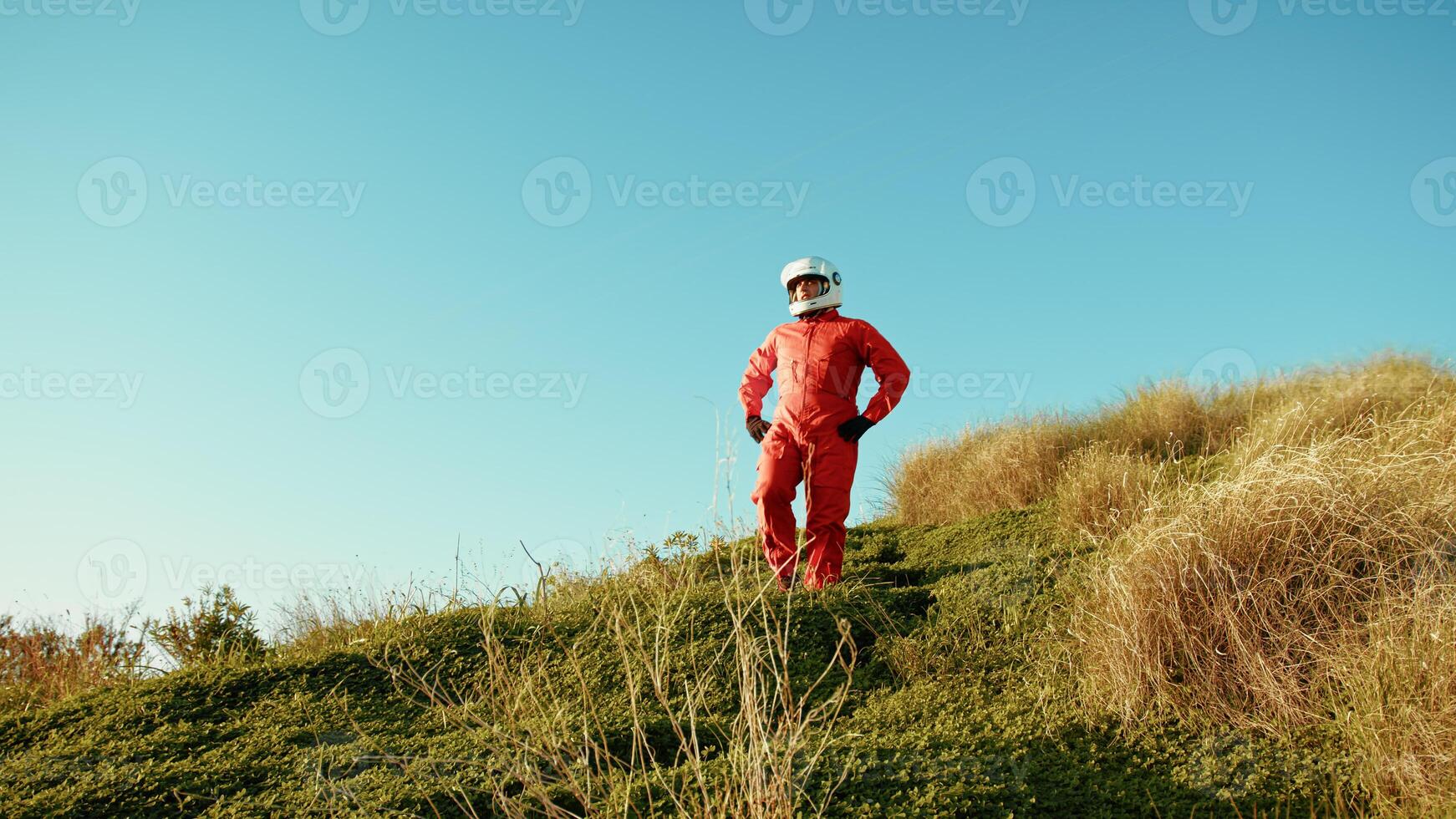 Astronaut Man Goes Down A Hill Into The New Planet Vegetables Exploration photo