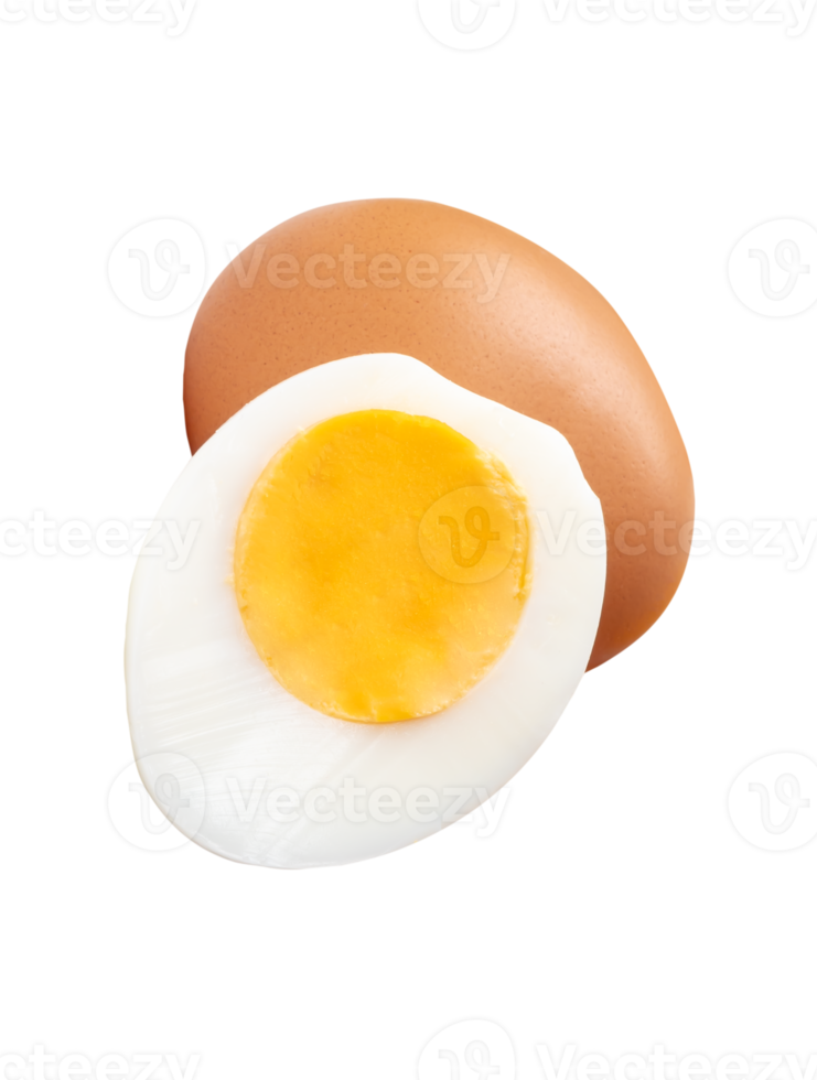 Cooked or boiled chicken egg with egg yolk in half and raw brown chicken egg in small pile isolated with clipping path in file format png