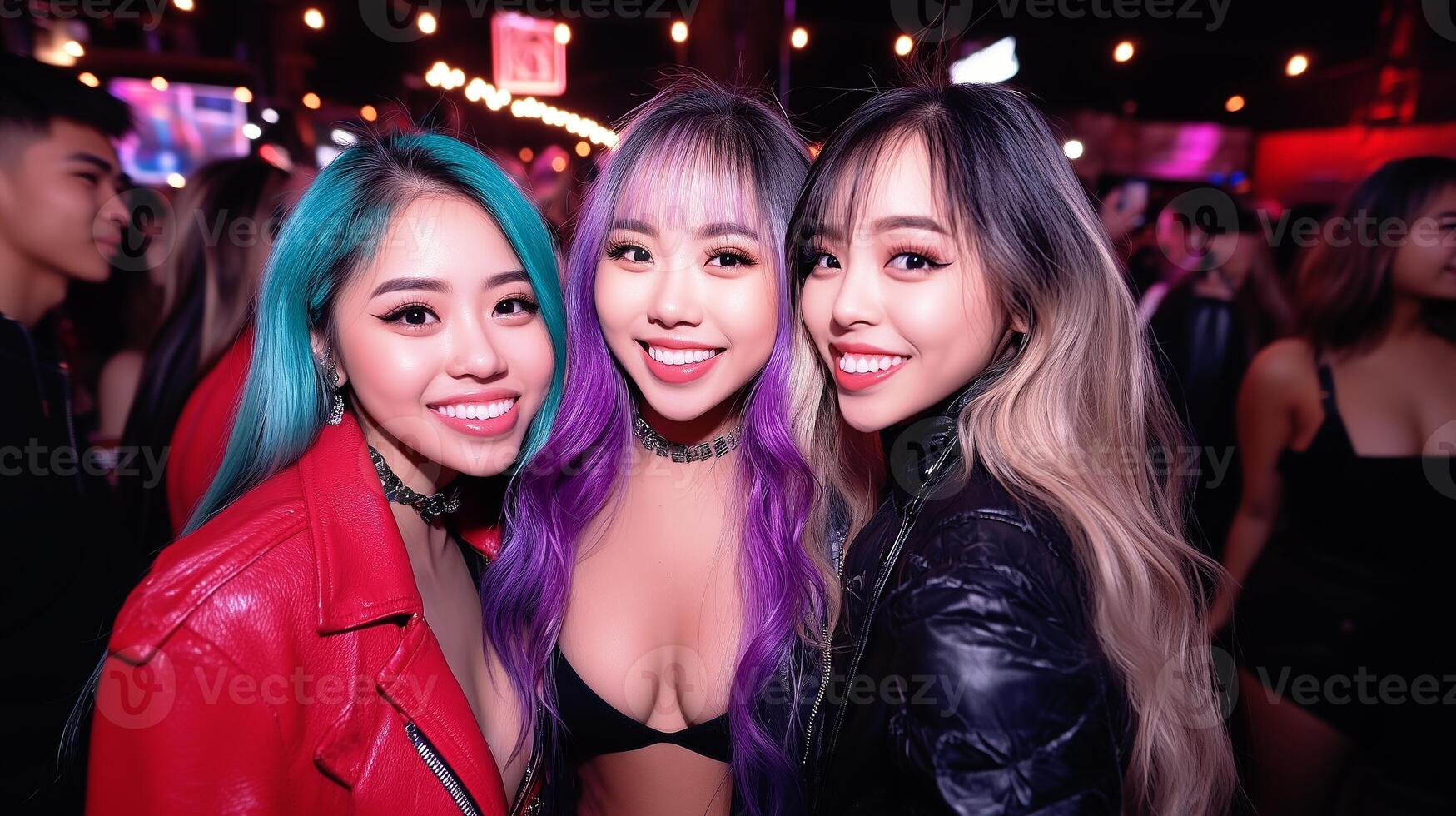 Group of asian party girls posing for flashlight photo. Three young women and having fun at nightclub. photo