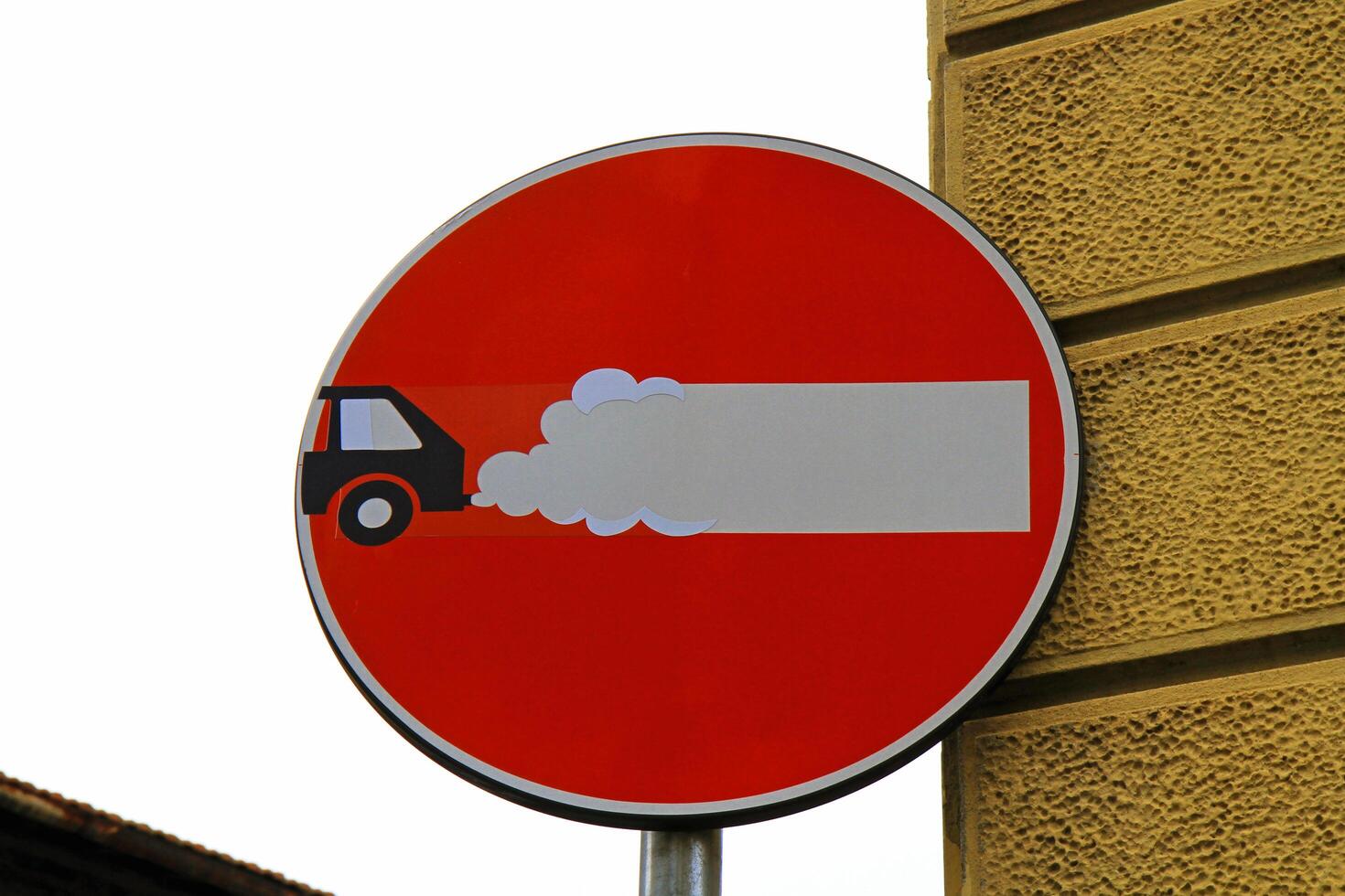 Creative road sign No entry with illustration of car emissions. photo