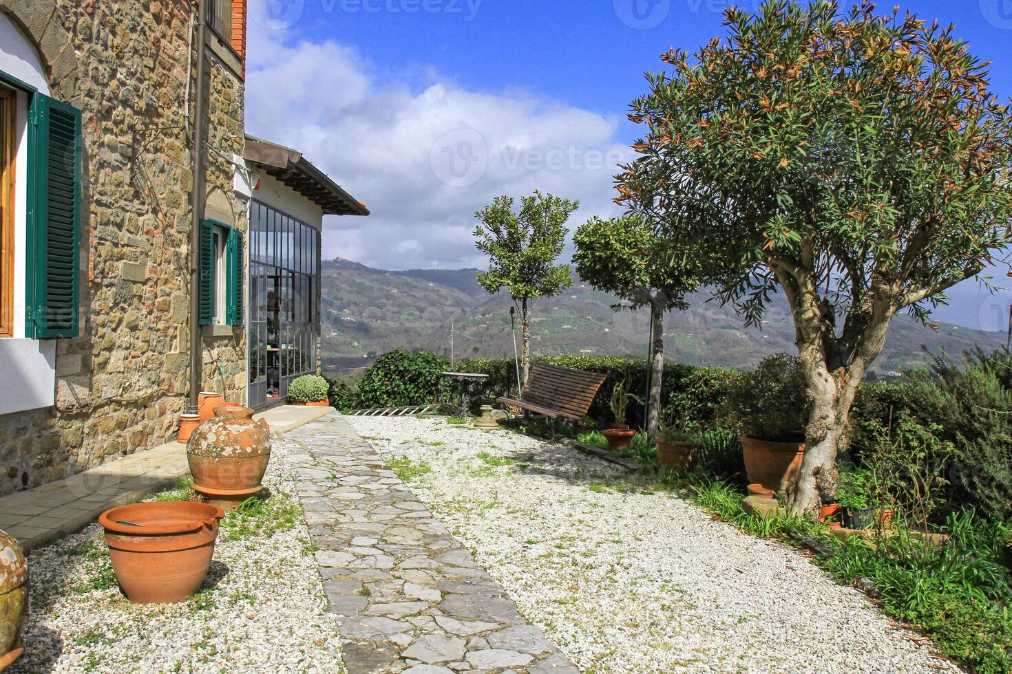 The rustic architecture, greenery and tranquil atmosphere create the perfect retreat for relaxation and travel inspiration. photo