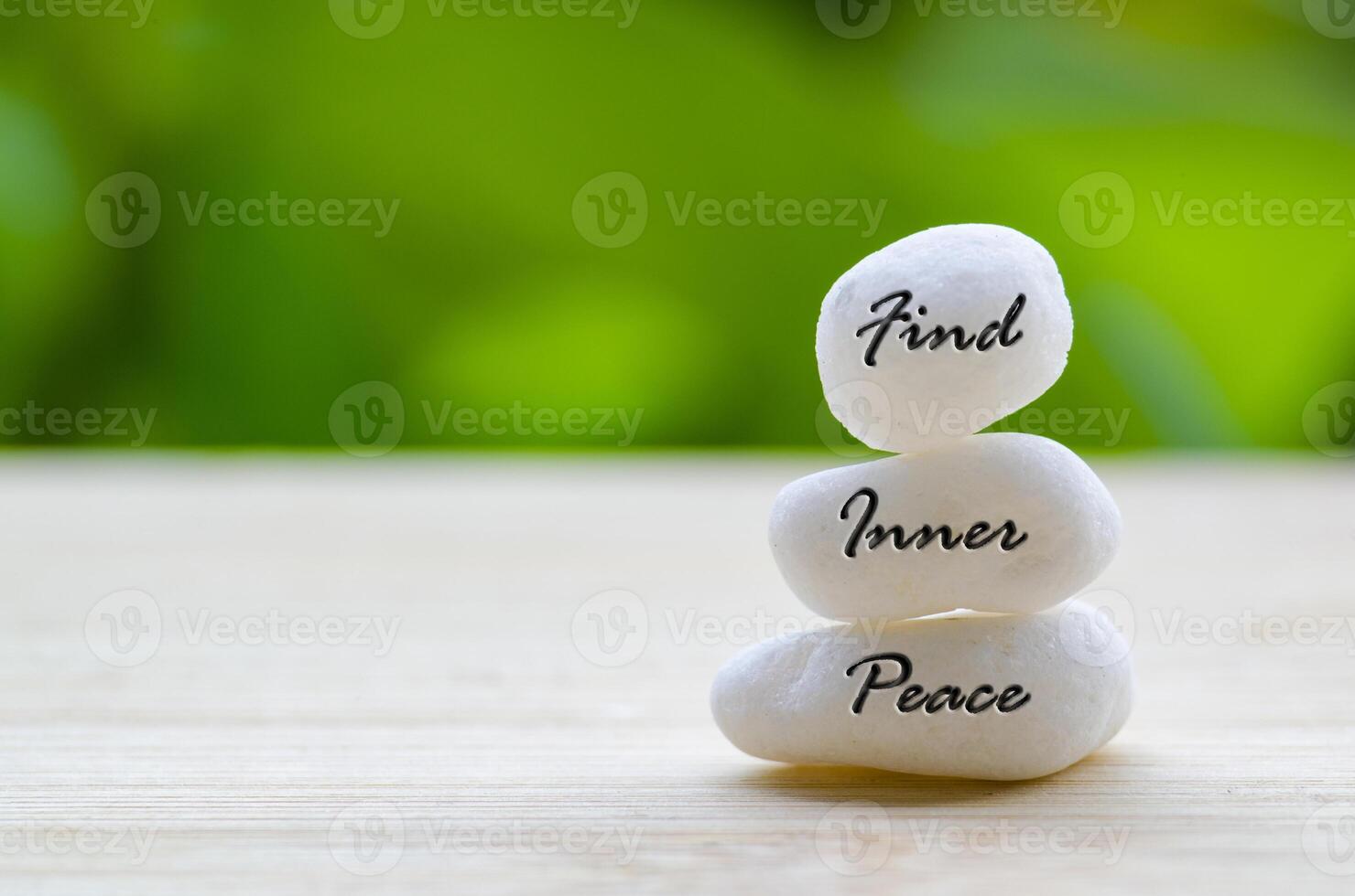 Find Inner Peace text on the white Zen stones. Inner peace concept photo