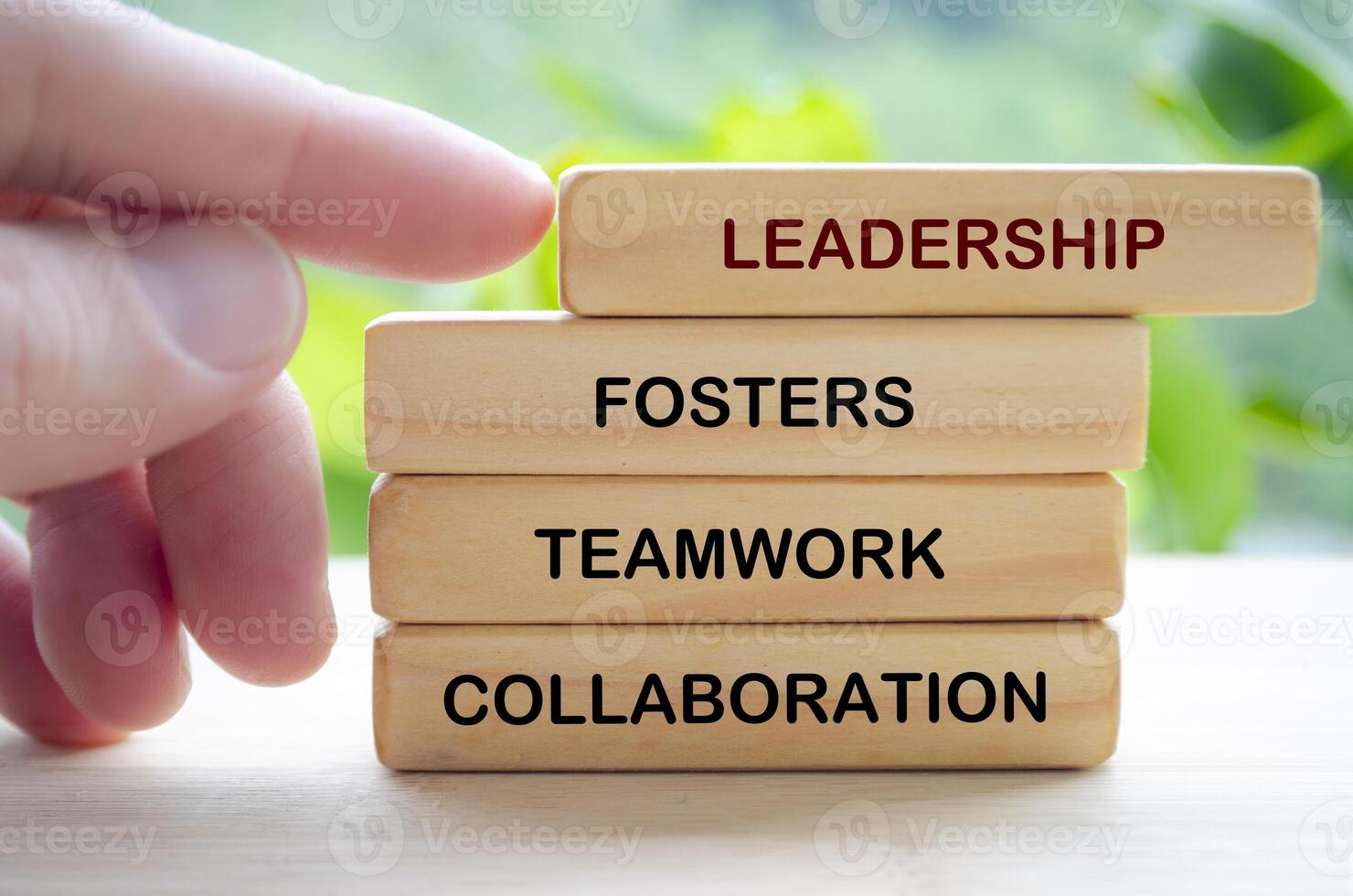 Leadership fosters teamwork and collaboration text on wooden blocks. Leadership concept photo