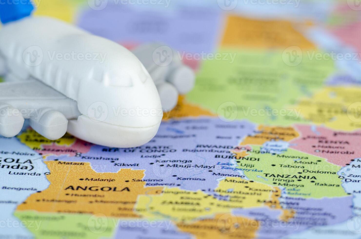 Close up of small toy airplane placed on a world map representing travel or global exploration. Travel and destination concept photo
