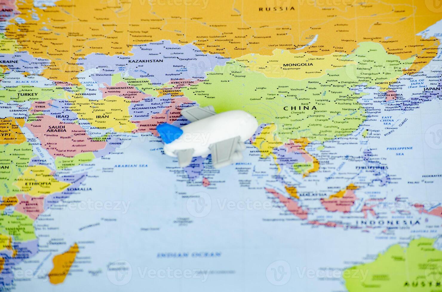 Small airplane placed on a world map.Travel and exploration concept photo