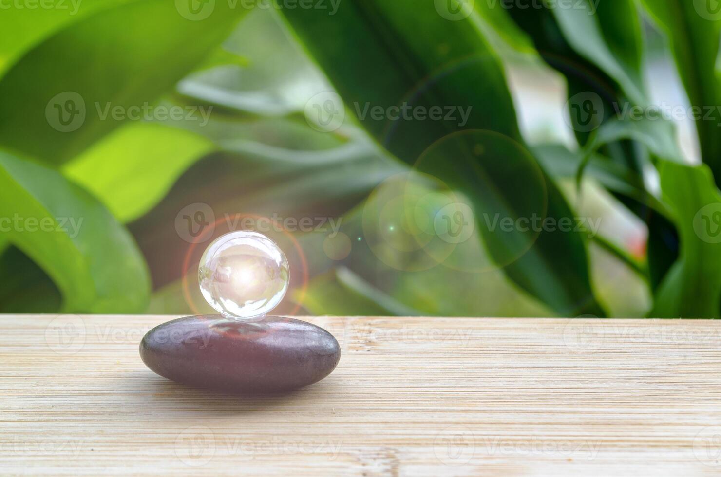 Black Zen stone with customizable space for text or message. Shining glass marble background. photo