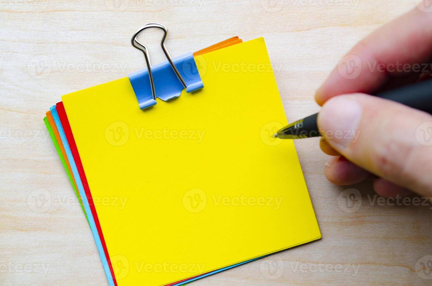 Top view of yellow notepad with customizable space for text photo