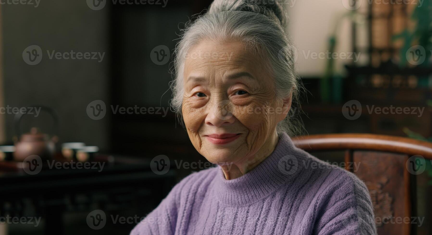 Graceful elderly asian woman in traditional tea room setting for cultural storytelling and heritage photo