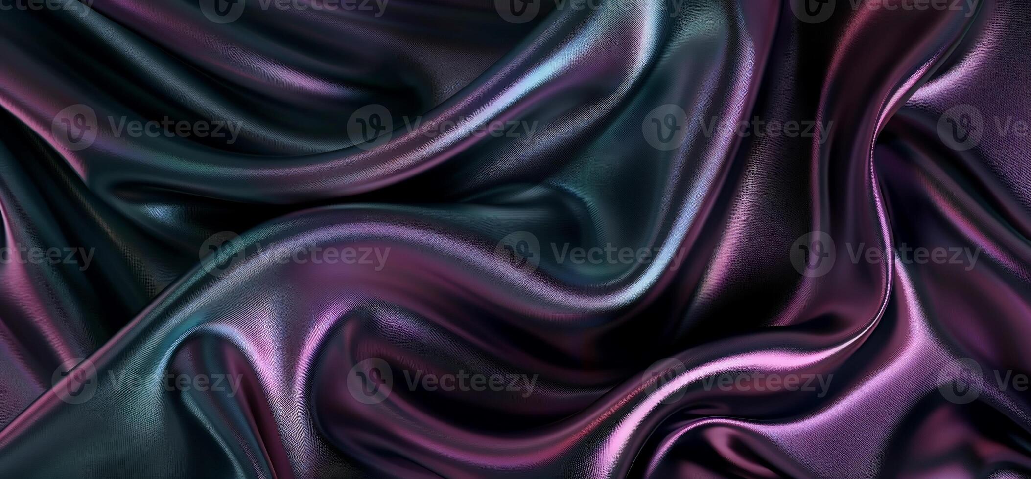 Fluid, iridescent fabric drapes in dark hues photo