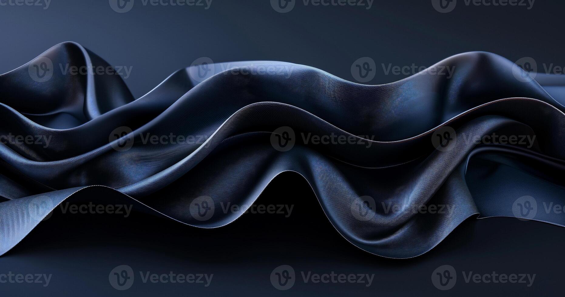 Dark, flowing fabric drapes in elegant waves photo