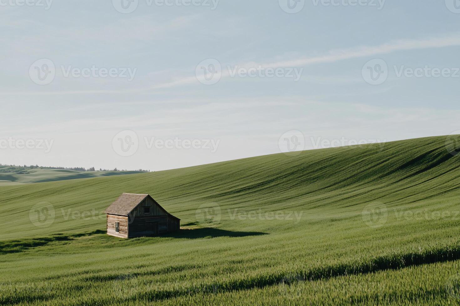 Rustic farmhouse on rolling green hills photo