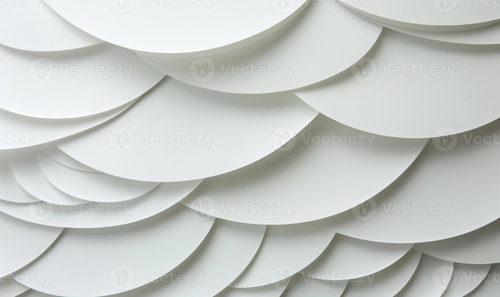 Abstract layered circles in soft white. A textured pattern of overlapping circles creates a visual depth. Soft light highlights the curves and folds photo
