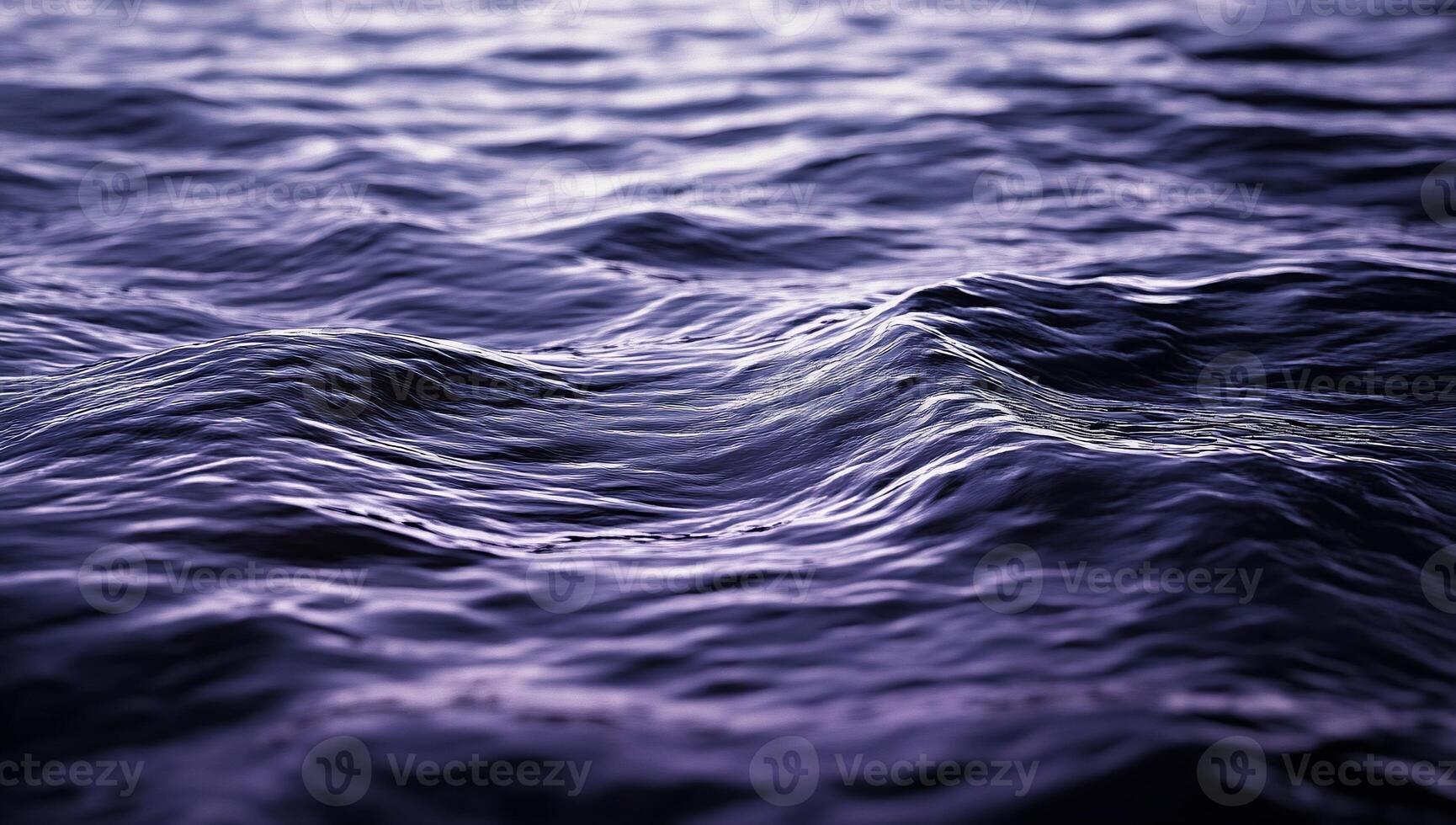 Abstract view of rippling water. Detailed surface texture, deep purple hues photo