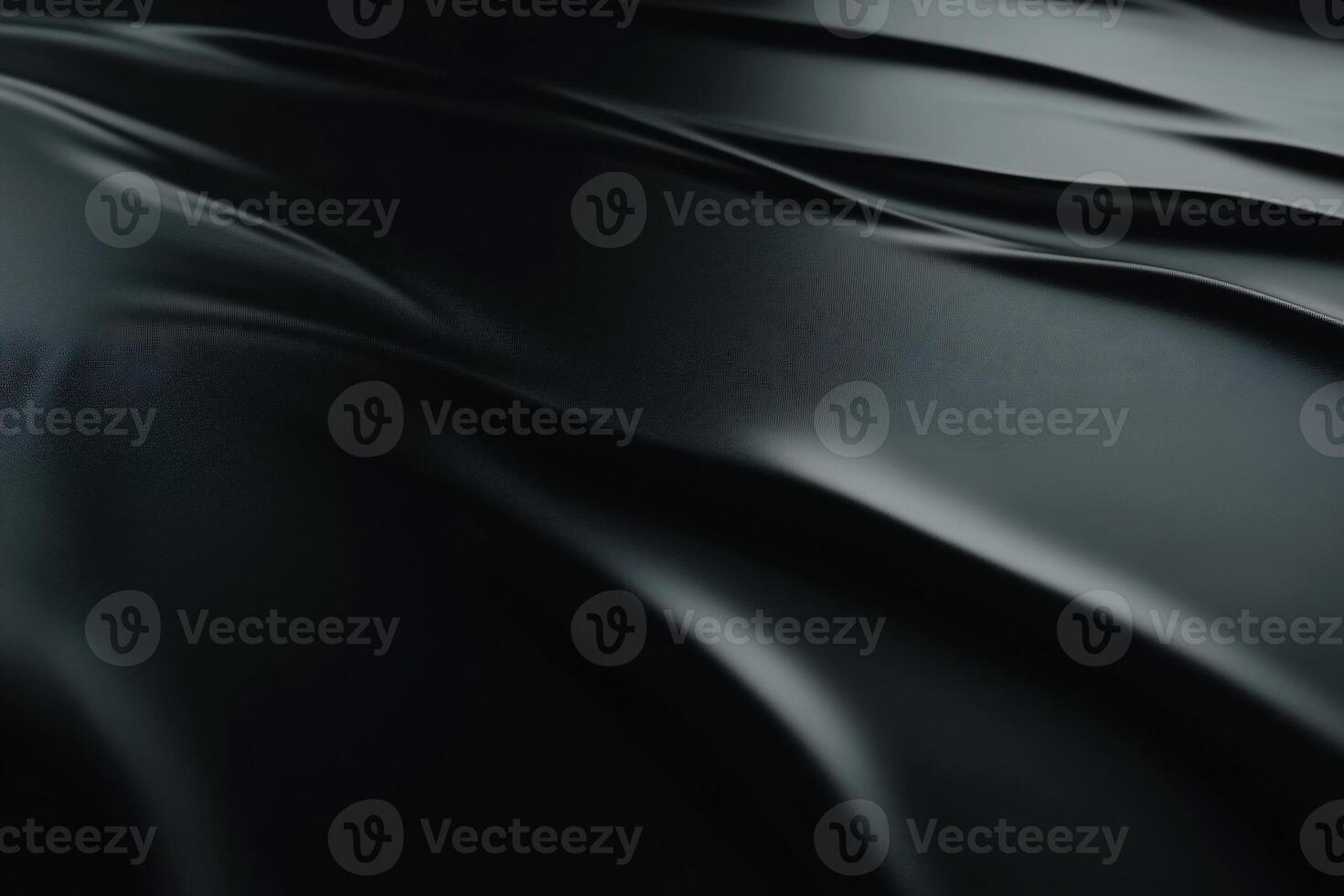 Dark, flowing fabric drapes. Detailed close-up of smooth, luxurious folds photo