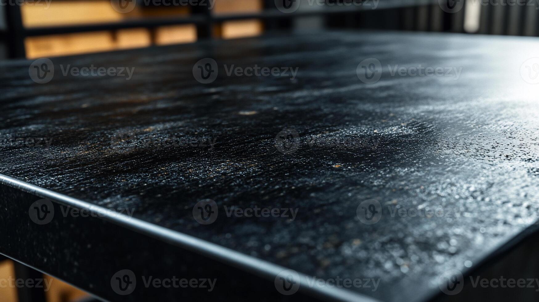 Dark, textured tabletop. Close-up view of a black, distressed surface photo