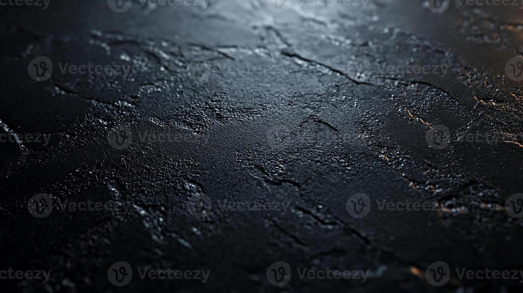 A black surface with some scratches and dirt photo