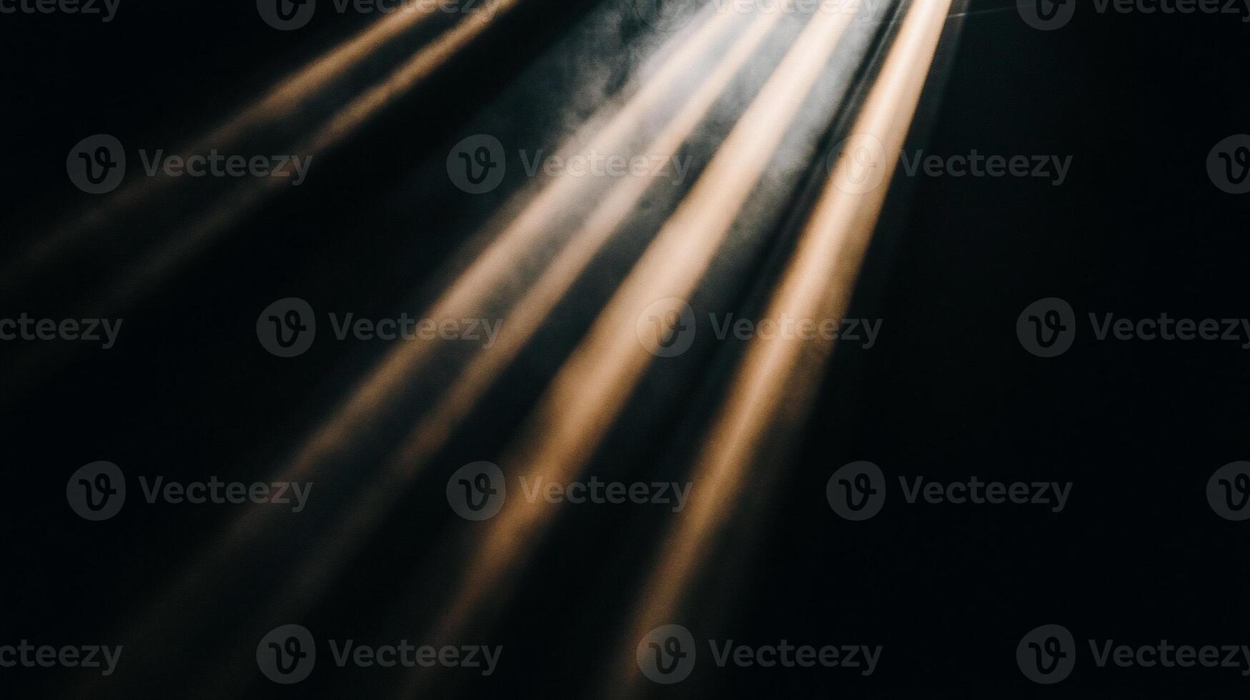 Light beams illuminating a dark space photo