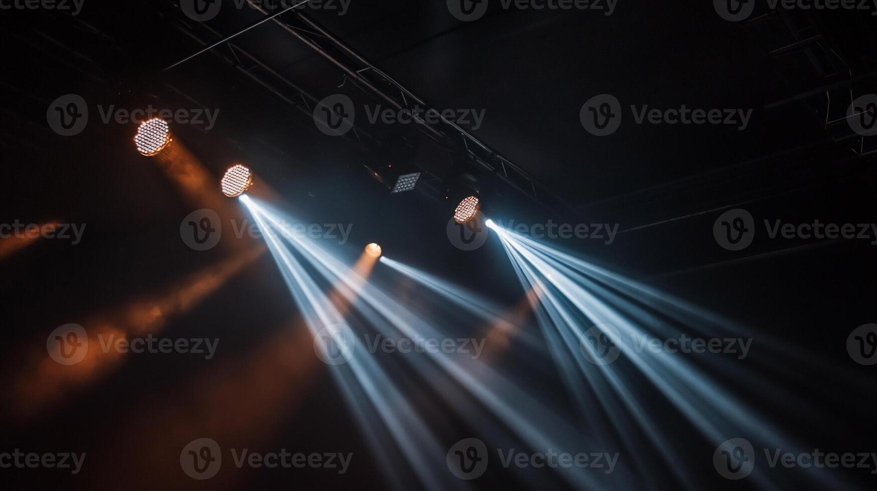Stage lights illuminating the darkness photo