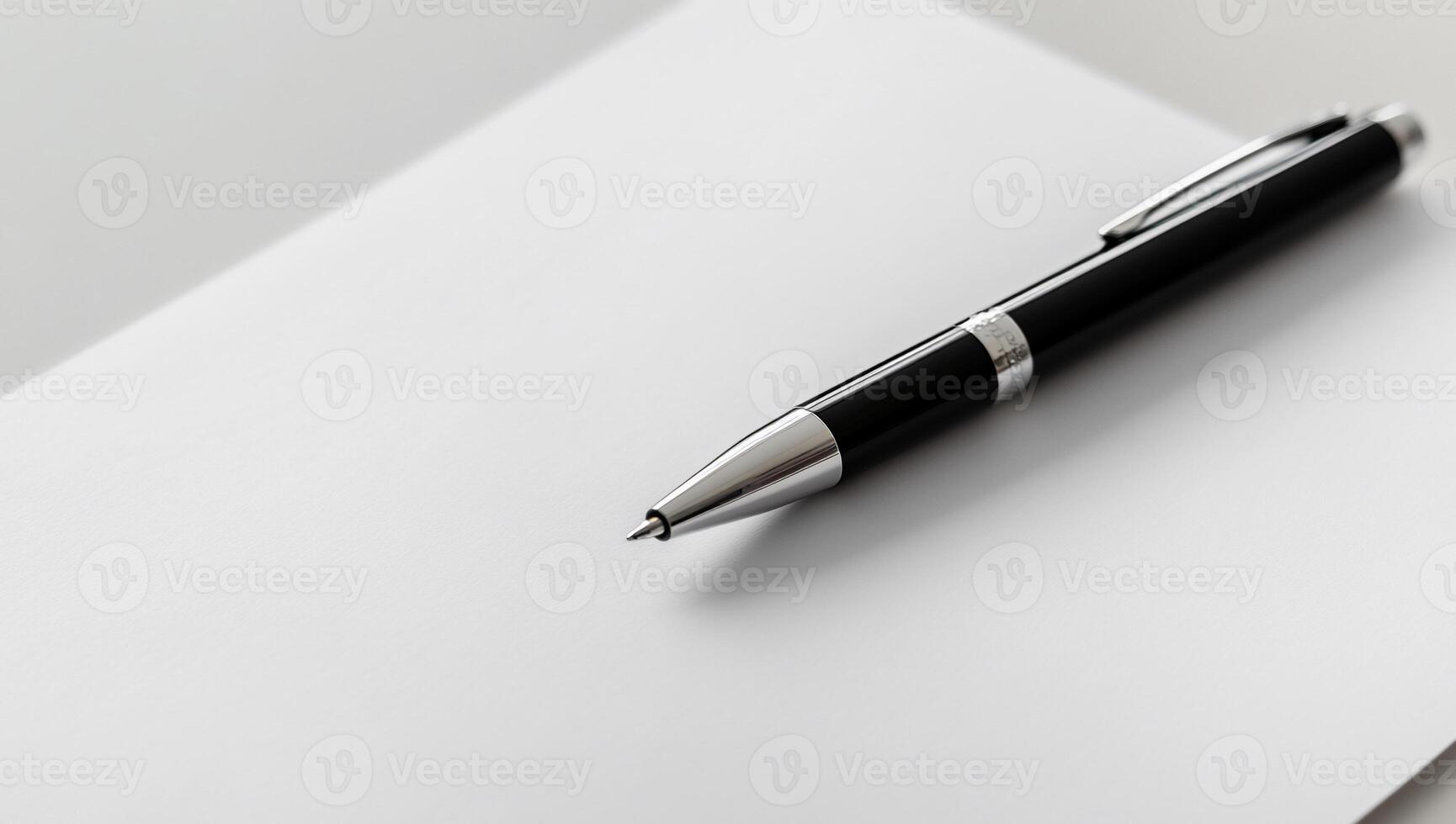 Blank paper with a pen photo