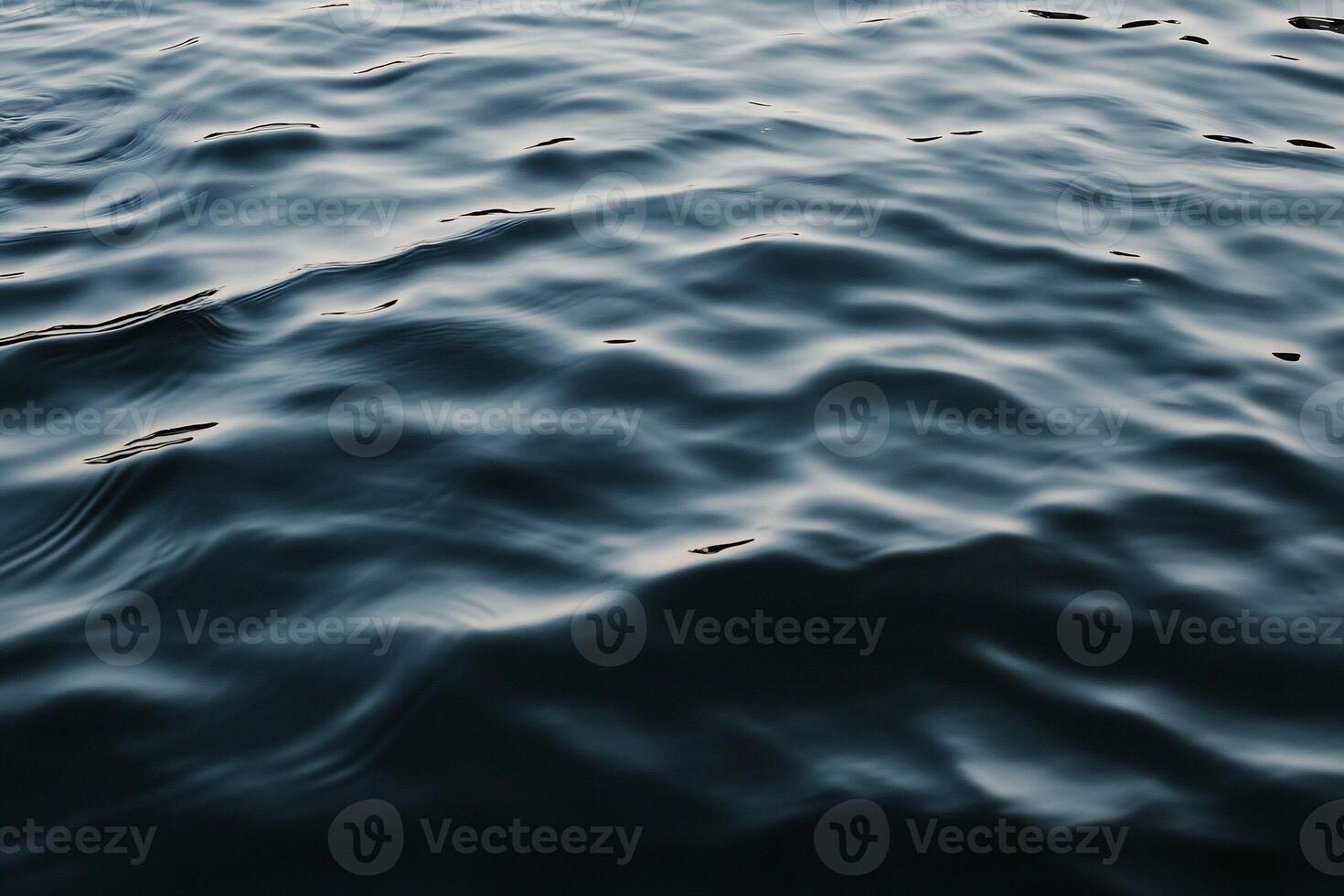 Rippled dark water surface photo