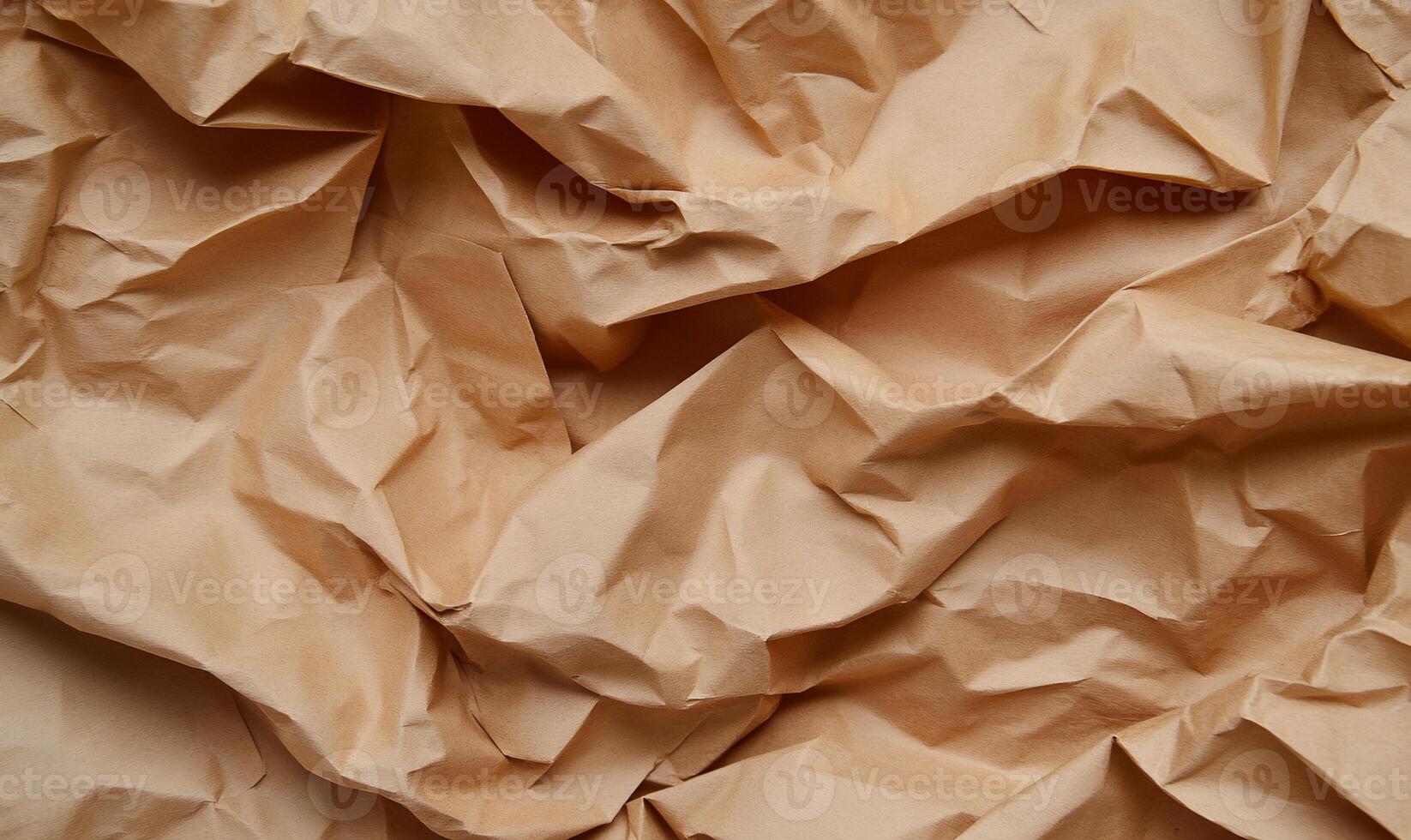 Crumpled beige paper texture photo