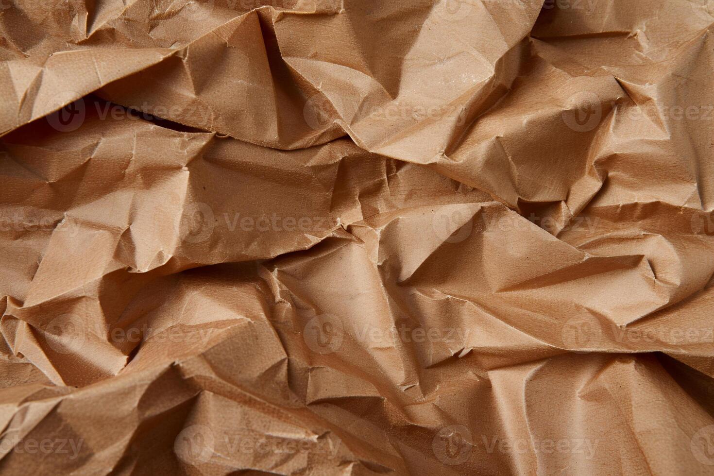 Crinkled brown kraft paper texture photo