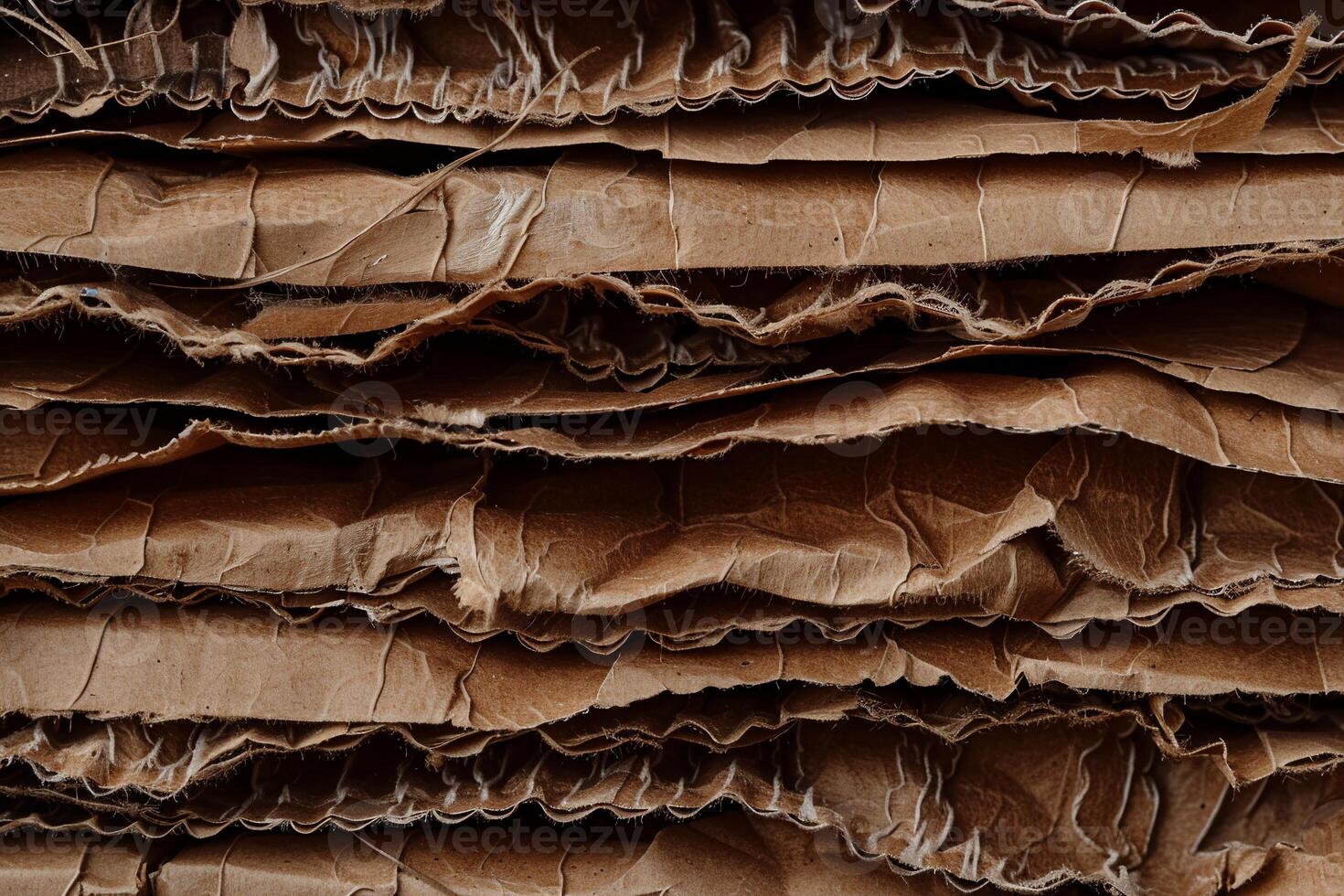 Stacked cardboard layers. Crinkled, brown, recycled paper texture photo