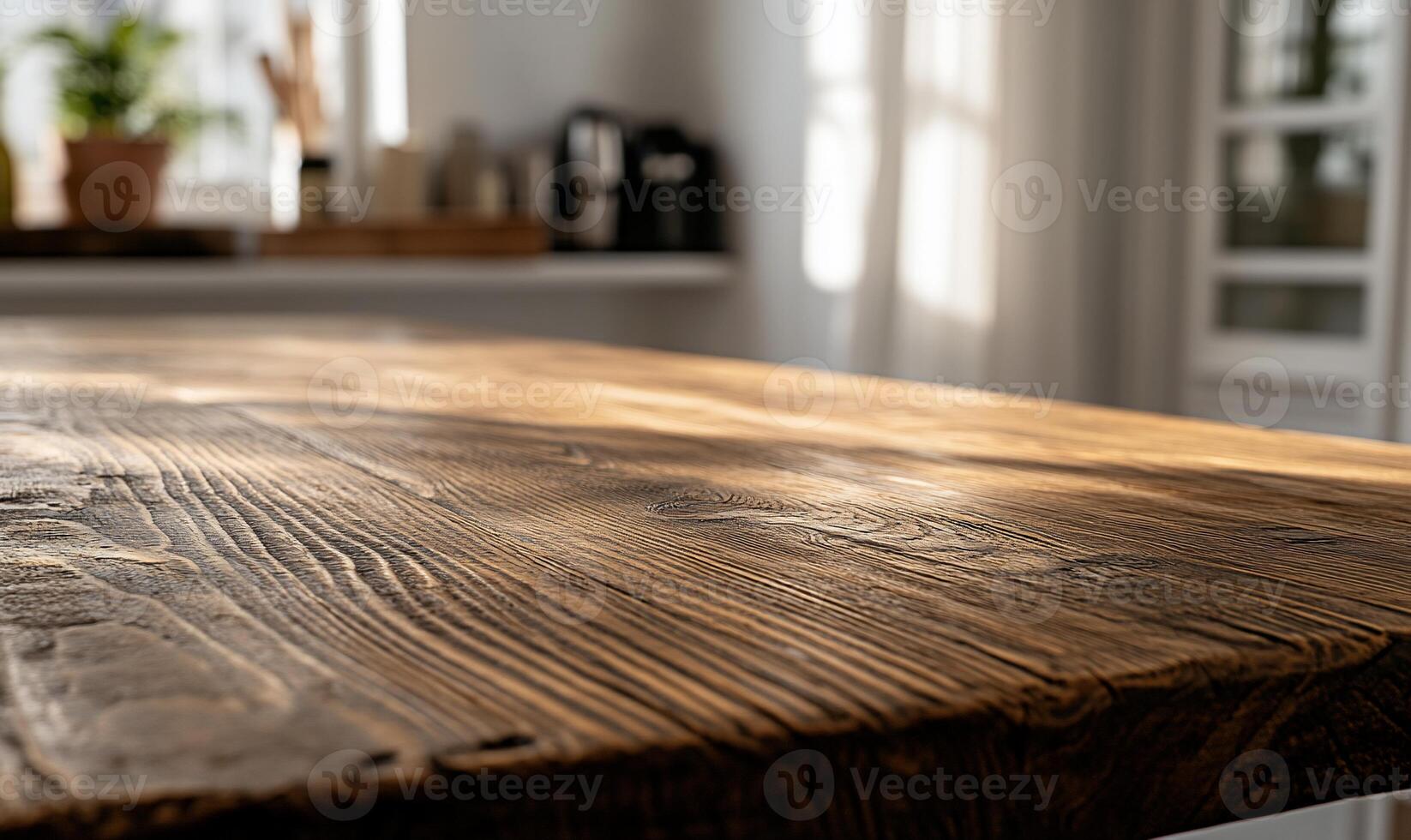 Rustic wooden table top in a bright kitchen photo