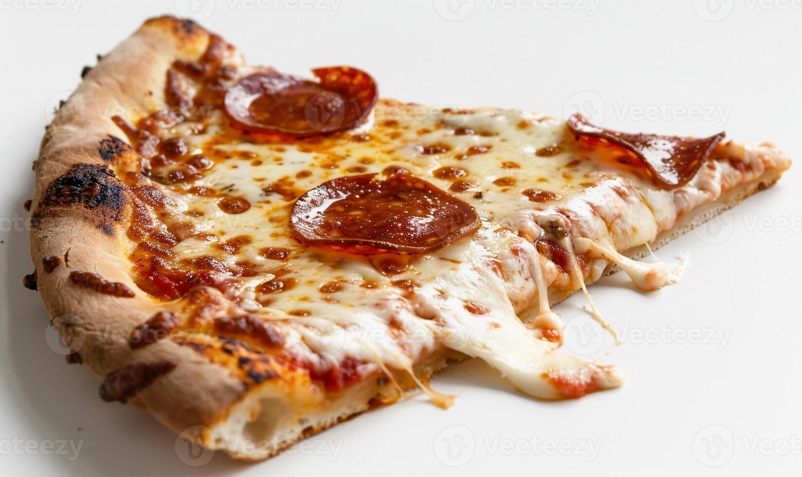 A slice of pizza on a white surface photo