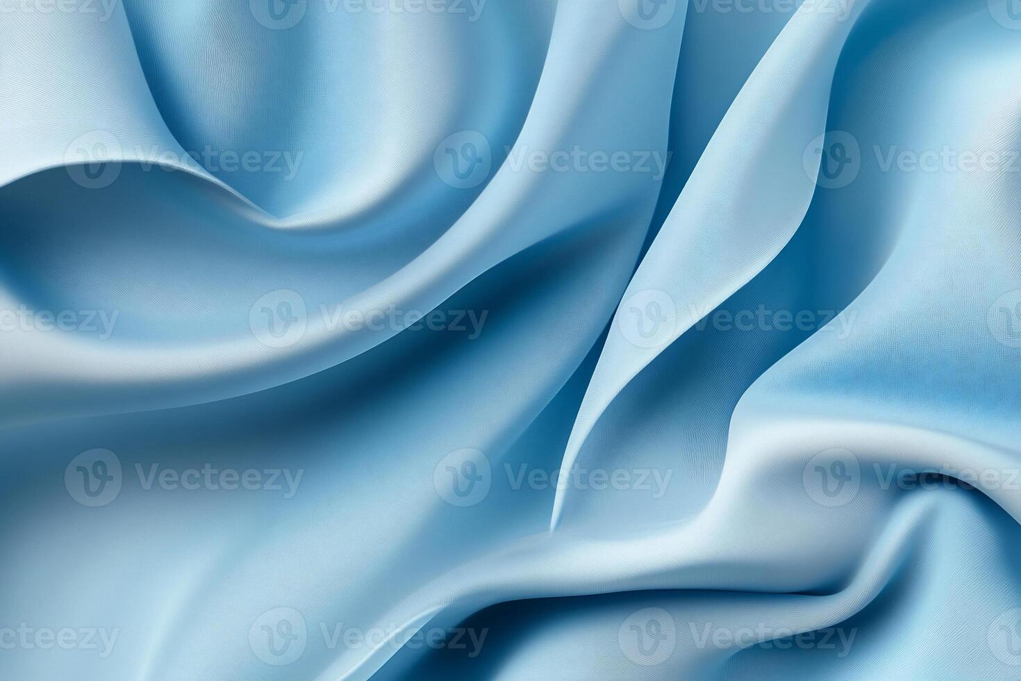 Blue silk fabric background with folds photo