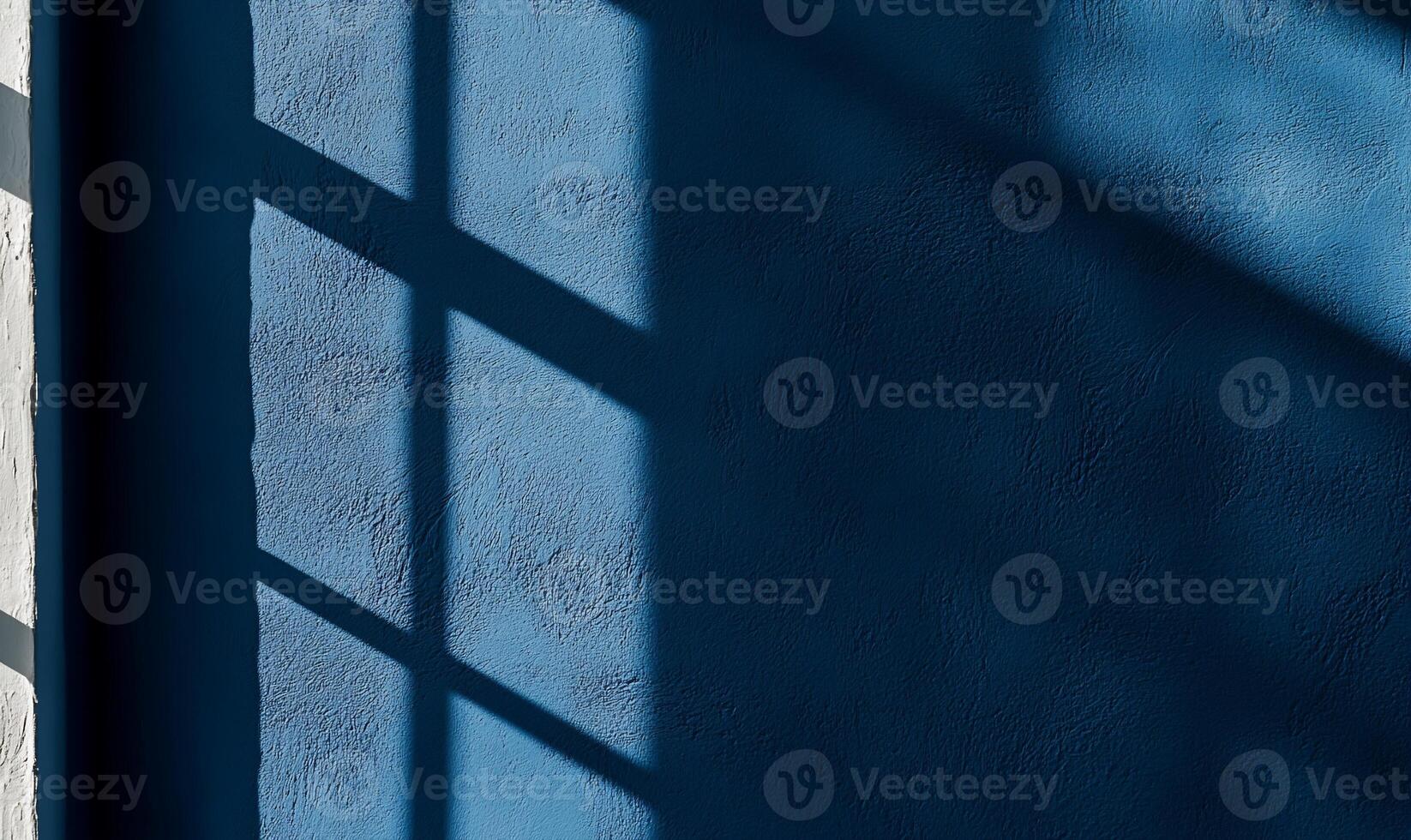 Shadows of a window on a textured wall photo