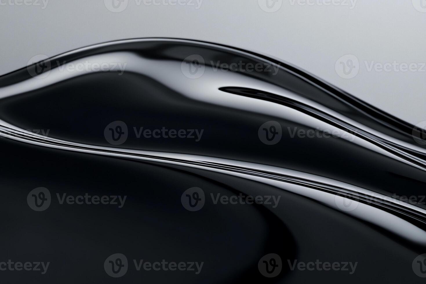 Sleek, dark, flowing abstract form with glossy, reflective surface photo