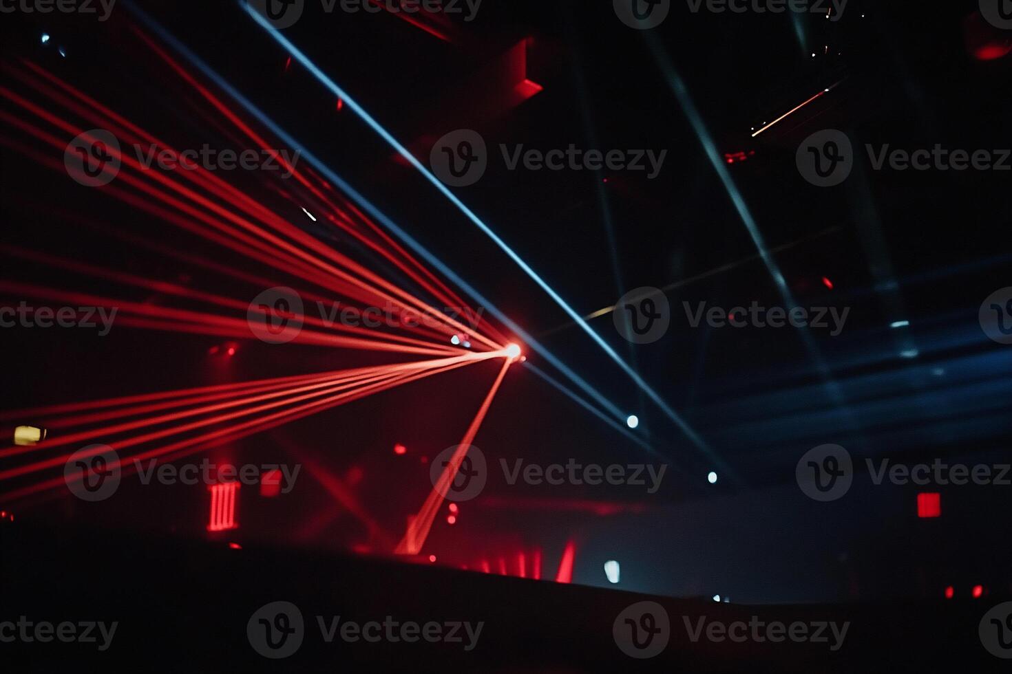 Vibrant stage lights crisscross in a dark club photo