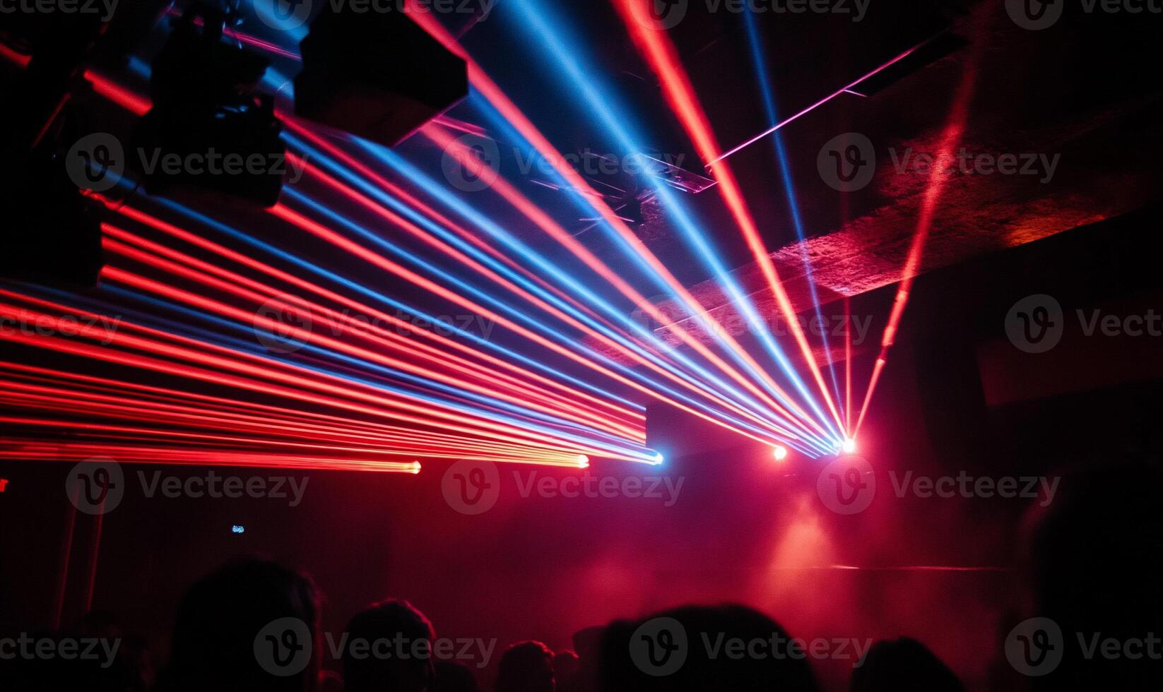 Vibrant laser beams illuminate a crowded club photo