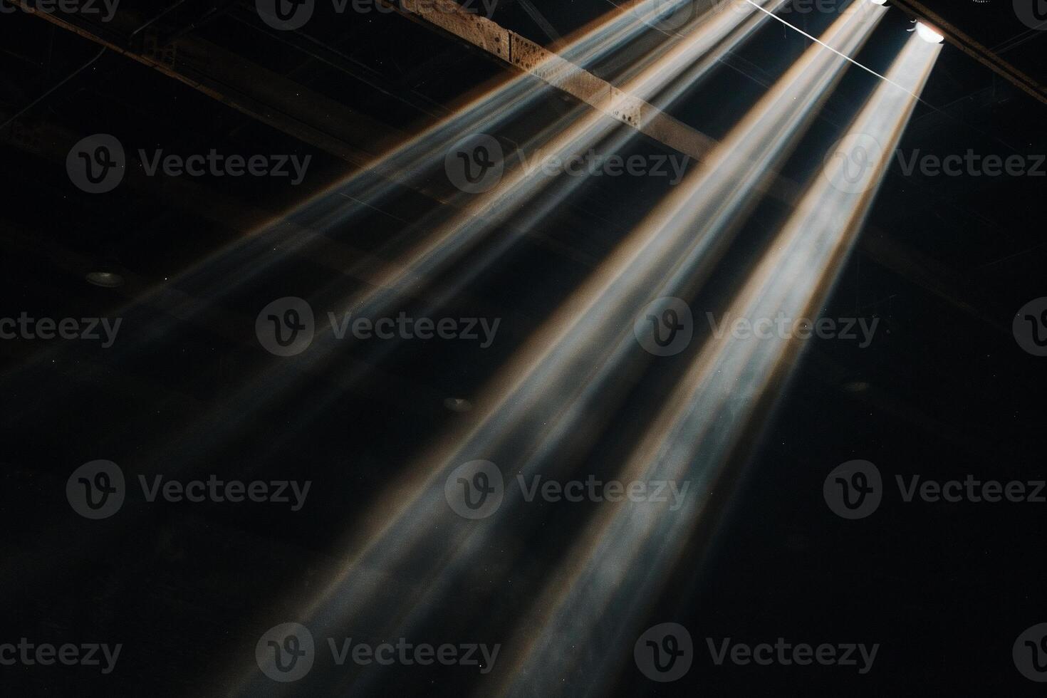 Light beams coming from the ceiling of a room photo