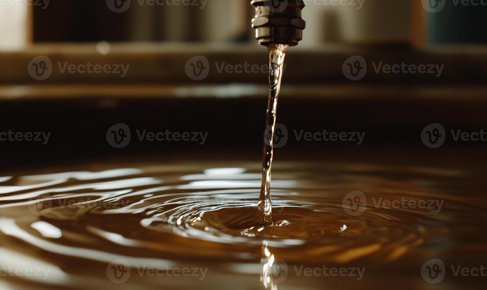 A close up of a water faucet dripping water photo