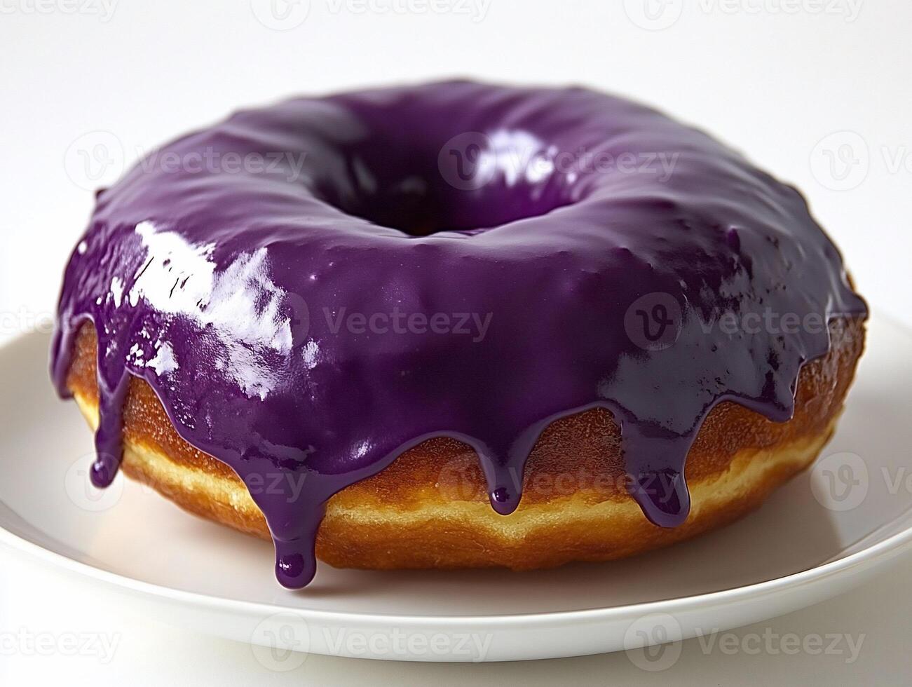 A donut with purple icing photo